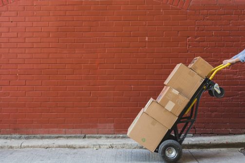 shipping-boxes-in-front-of-red-brick